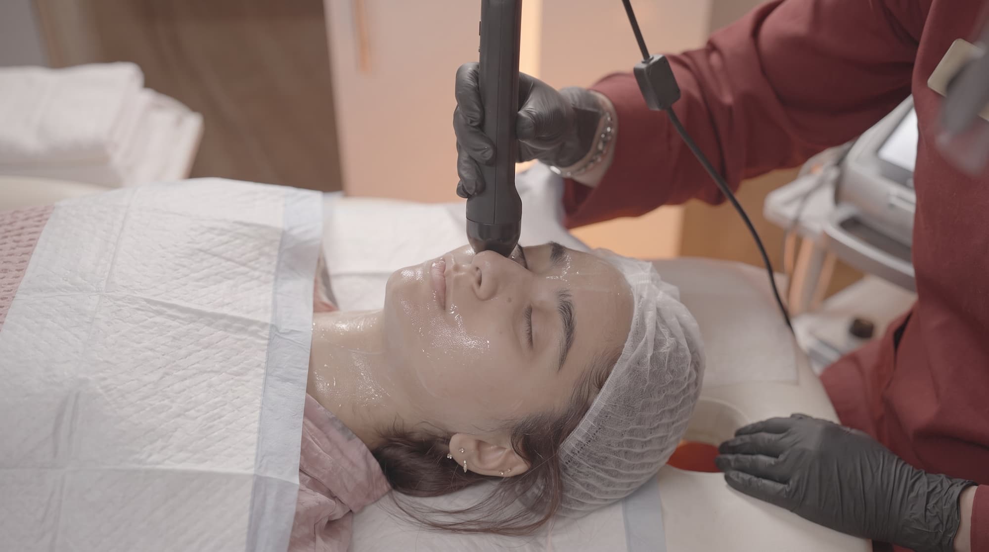 A facial treatment being carried out with clinical care