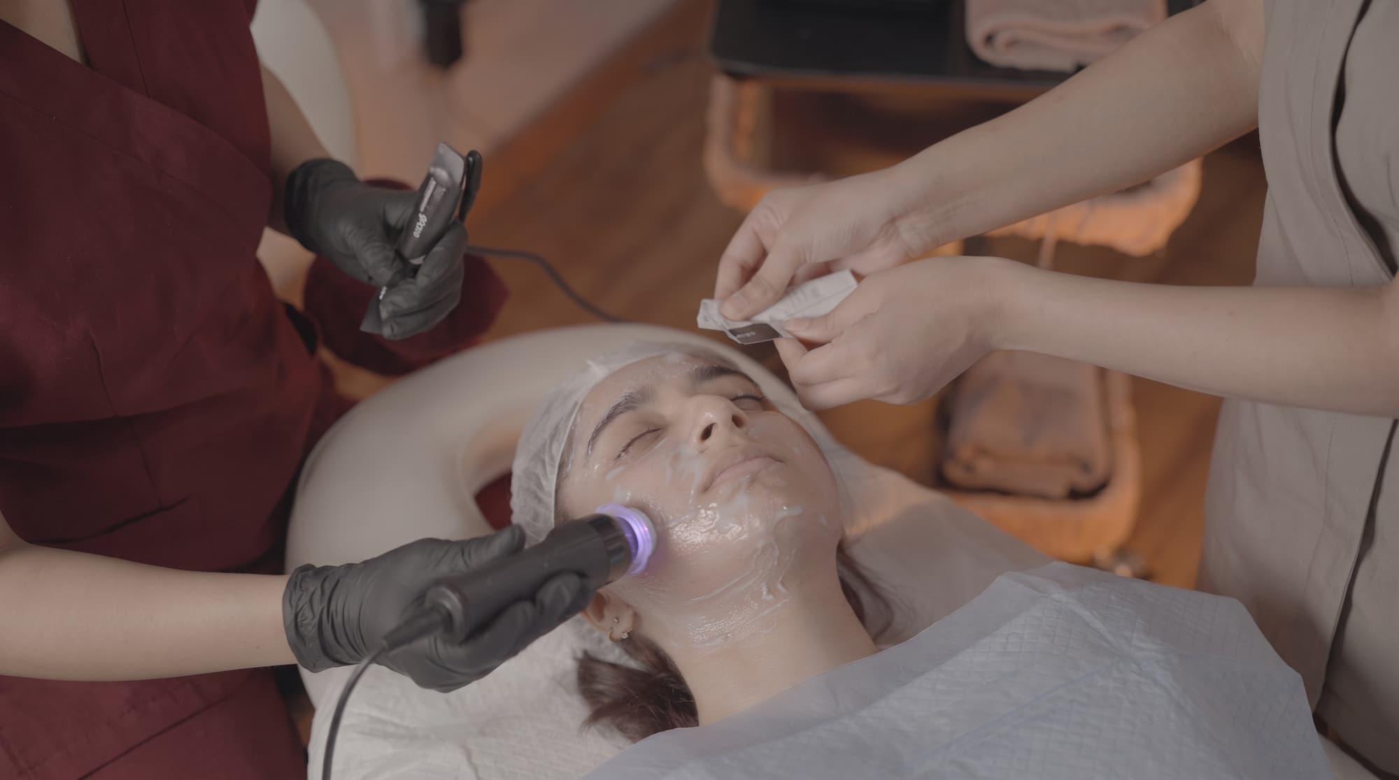 Two Chisel Health clinicians working together during a facial treatment